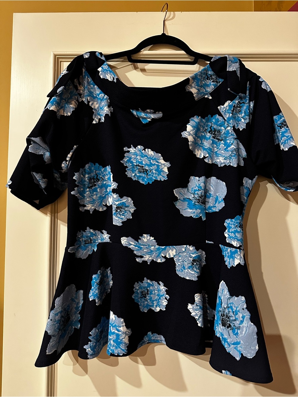 Essentials Black Peplum Blouse with Blue and White Floral Print